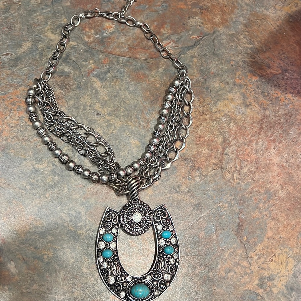 Women’s western horseshoe necklace.
